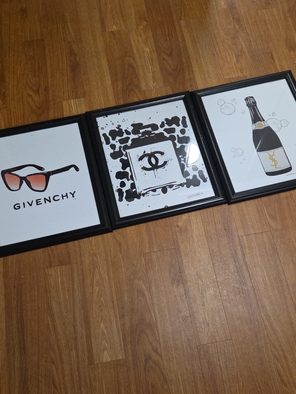 Set Of 3 Framed Fairchild Paris Art Pieces - Givenchy, Chanel, YSL Champagne
